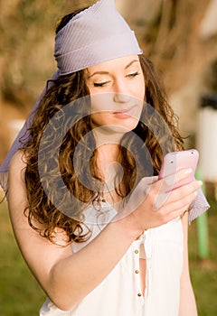 Beautiful young caucasian girl talking at the mobile phone
