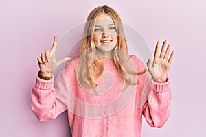 Beautiful young caucasian girl wearing casual clothes showing and pointing up with fingers number seven while smiling confident