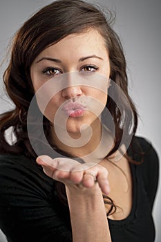 Beautiful Young Caucasian Woman Blowing A Kiss