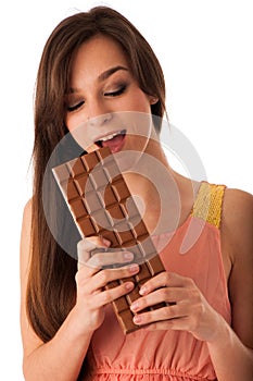 Beautiful young caucasian woman eating chocolate