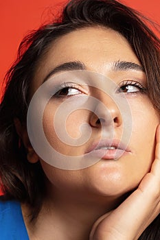 Beautiful young caucasian woman. Face close up. Pretty female model at studio. Concept of beauty, body, skin care