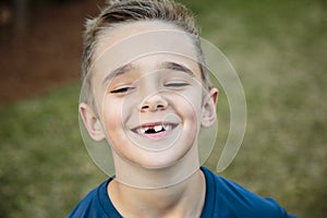 Beautiful young child smiling with a toothy smile