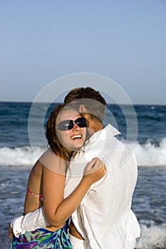 Beautiful young couple on beach