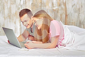 Beautiful young couple in bed