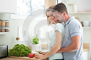 beautiful young couple cooking dinner