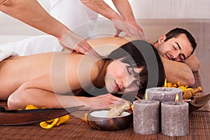 Beautiful young couple enjoying massage