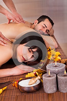 Beautiful young couple enjoying massage