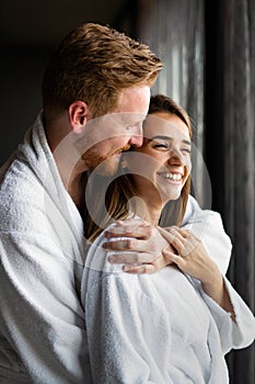 Beautiful young couple enjoying and relaxing in SPA center. People enjoying weekend, holiday