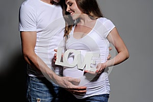 Beautiful young couple expecting baby