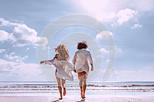 Beautiful young couple having fun on the beach