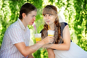 Beautiful Young Couple Having Fun. Picnic in Countryside. Happy