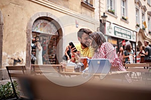 Beautiful young couple having a good time on street cafe in prague. Vaneltine, Europe, Prague