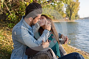 Beautiful young couple having their first kiss