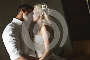 Beautiful young couple kissing with emotional embrace.