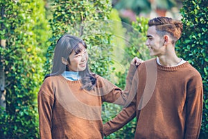 Beautiful young couple is looking Smiling happy in love outdoors