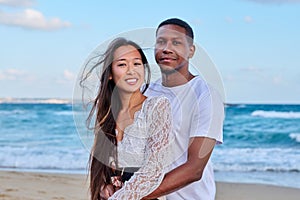 Beautiful young couple in love on the beach