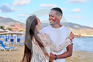 Beautiful young couple in love on the beach