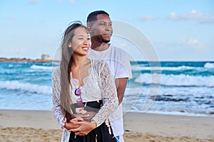 Beautiful young couple in love on the beach