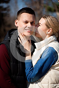 Beautiful young couple in love walks in the park