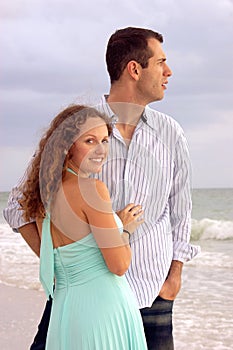 Beautiful young couple at the ocean