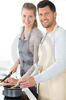 beautiful young couple preparing healthy meal together