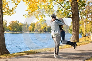 Beautiful young couple walking outside in autumn