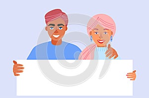 Beautiful young couple, woman and man holding a blank poster,empty sheet of white paper or board.joyful female and male