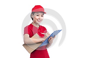 Beautiful young delivery woman in red t-shirt and cap smiling, h
