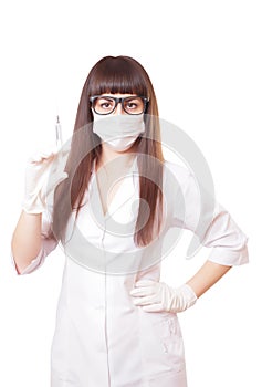 Beautiful young doctor in medical robe holding syringe