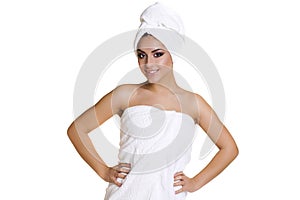 Beautiful young ethnic woman in white towel