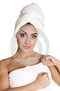 Beautiful young ethnic woman in white towel