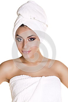 Beautiful young ethnic woman in white towel