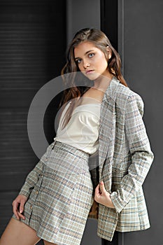 Beautiful young fashion model in business suit