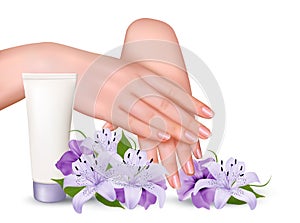 Beautiful young female hands with a cream and purple flowers.