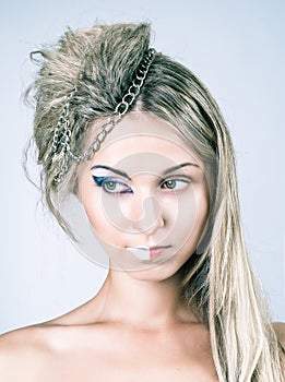 Beautiful young female with impudent make up