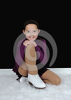 Beautiful young figure skater posing