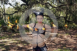 Beautiful Young Fire Performer in a Forest (1)