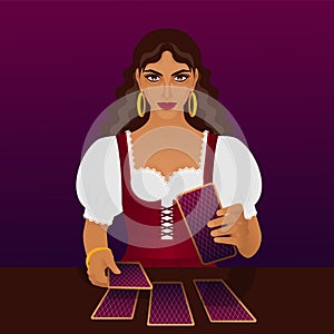 Beautiful young fortune teller with tarot cards