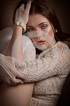 Woman with blue eyes on leather couch