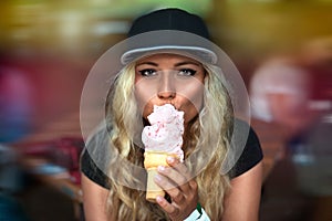 Beautiful young funny woman eating ice cream