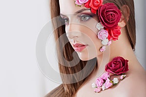 Beautiful young girl with applique flowers on the face.