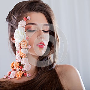 Beautiful young girl with applique flowers on the face.