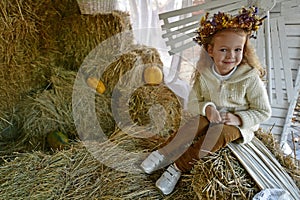 Beautiful young girl on an autumn walk in the village.