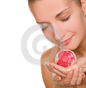 Beautiful young girl with a bath bomb