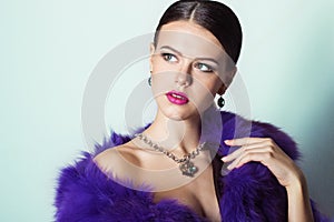 Beautiful young girl with beautiful stylish expensive jewelry, necklace, earrings, bracelet, ring, filming in the Studio