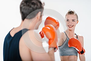 Young girl boxing with trainer
