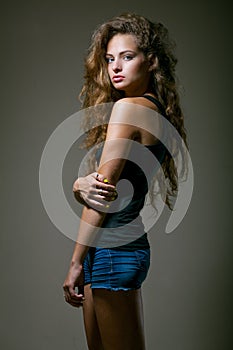 Beautiful young girl with curly hair