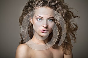 Beautiful young girl with curly hair