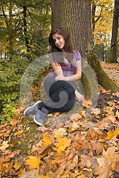 Beautiful young girl with dark hair in the park 3