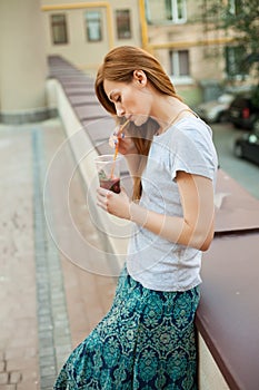 Young girl drinking lemonade